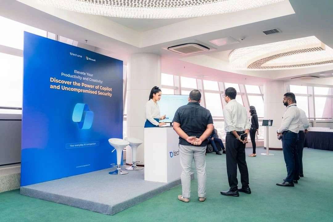 Aisha at Tech One Global event booth - Copilot and Security showcase