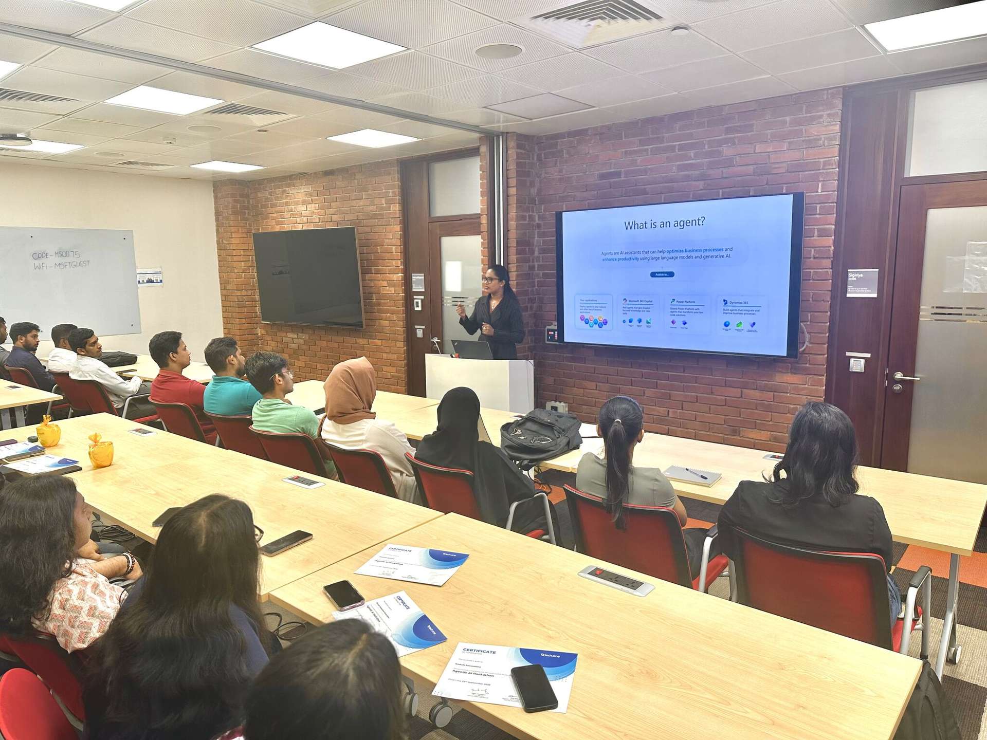 Aisha presenting to classroom audience - Agentic AI workshop